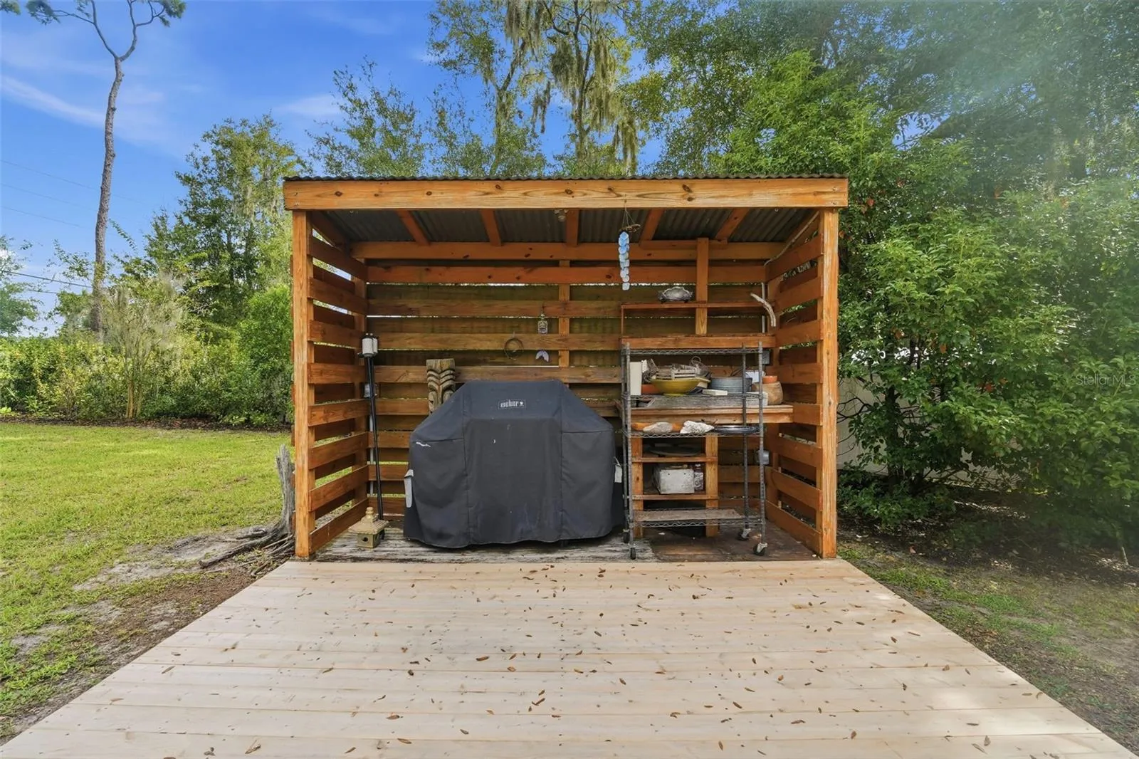 This barbecue patio in the fenced back yard is incredibly nice!