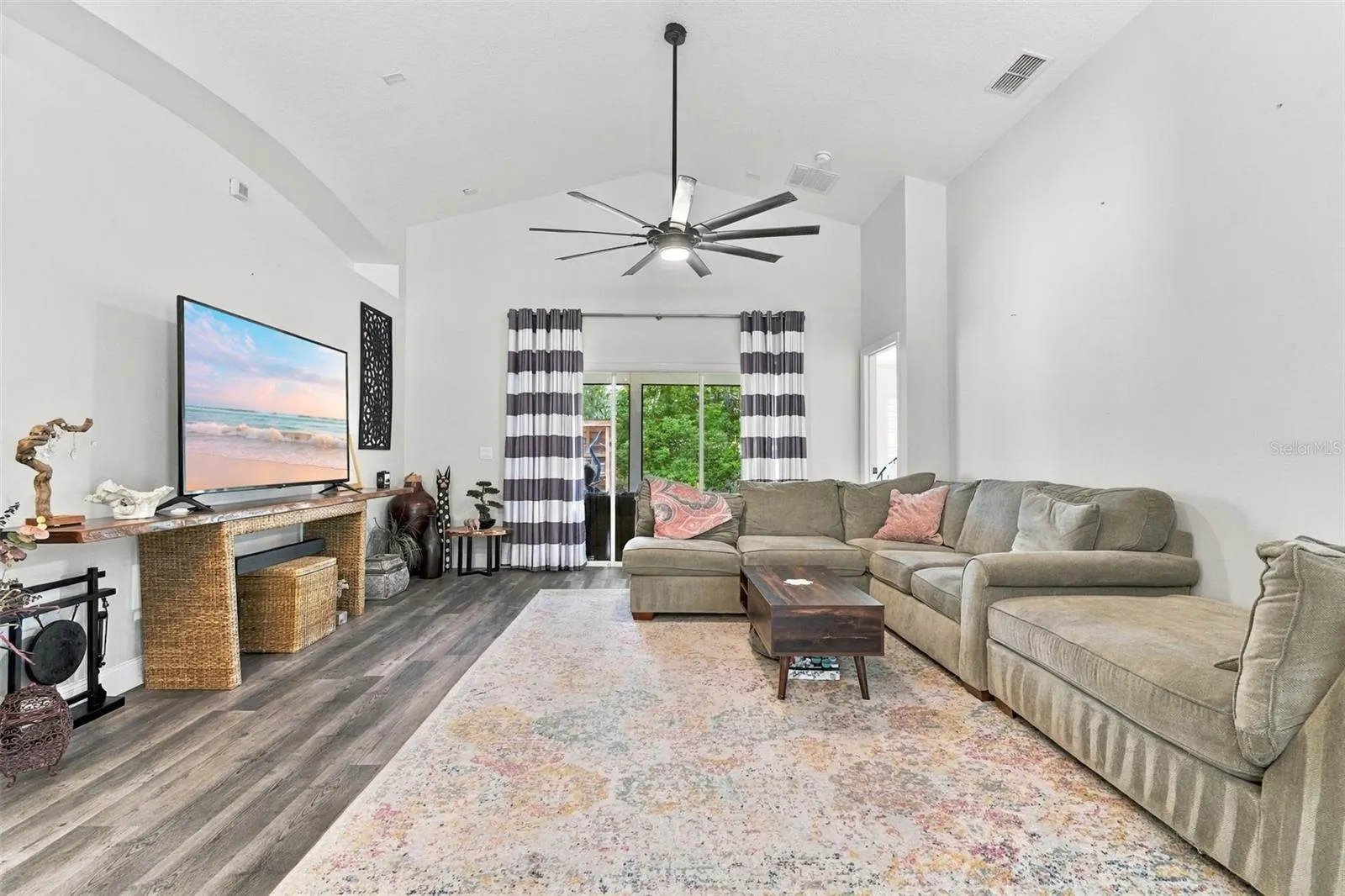 Main living area towards large screened porch.