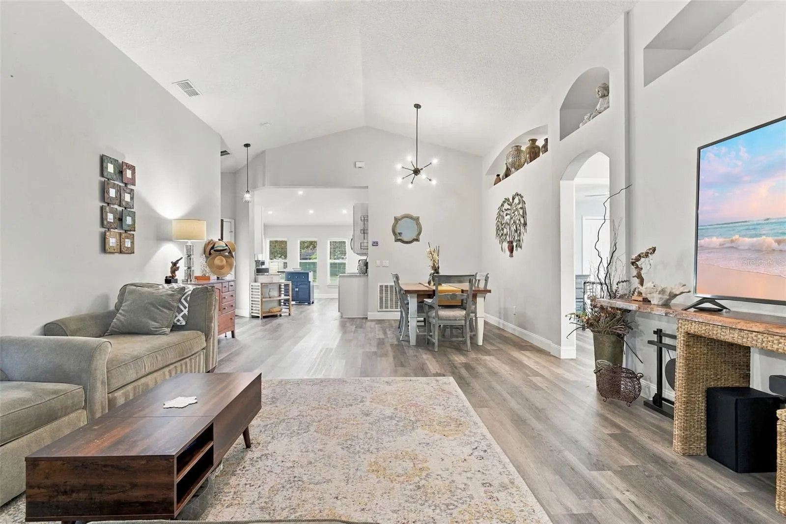 Main living area towards dining area. These ceilings are so nice!