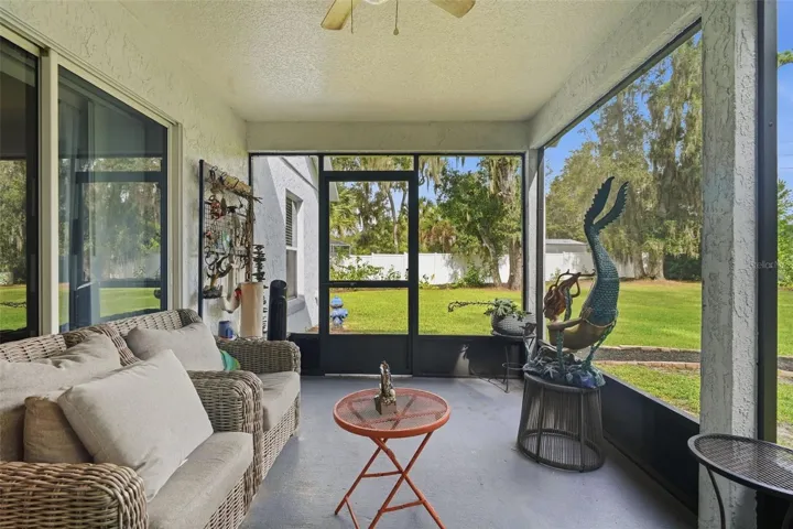 The large screened porch is the perfect place for enjoying life without the bugs.