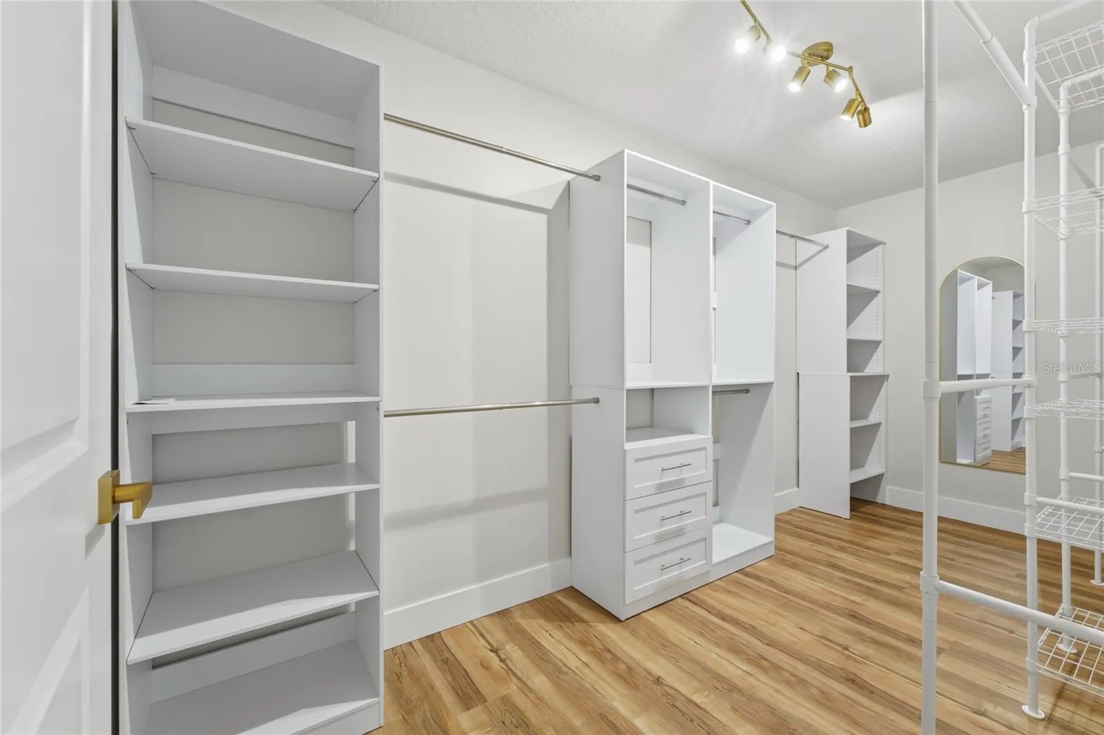 Master Closet with an organized wardrobe set up