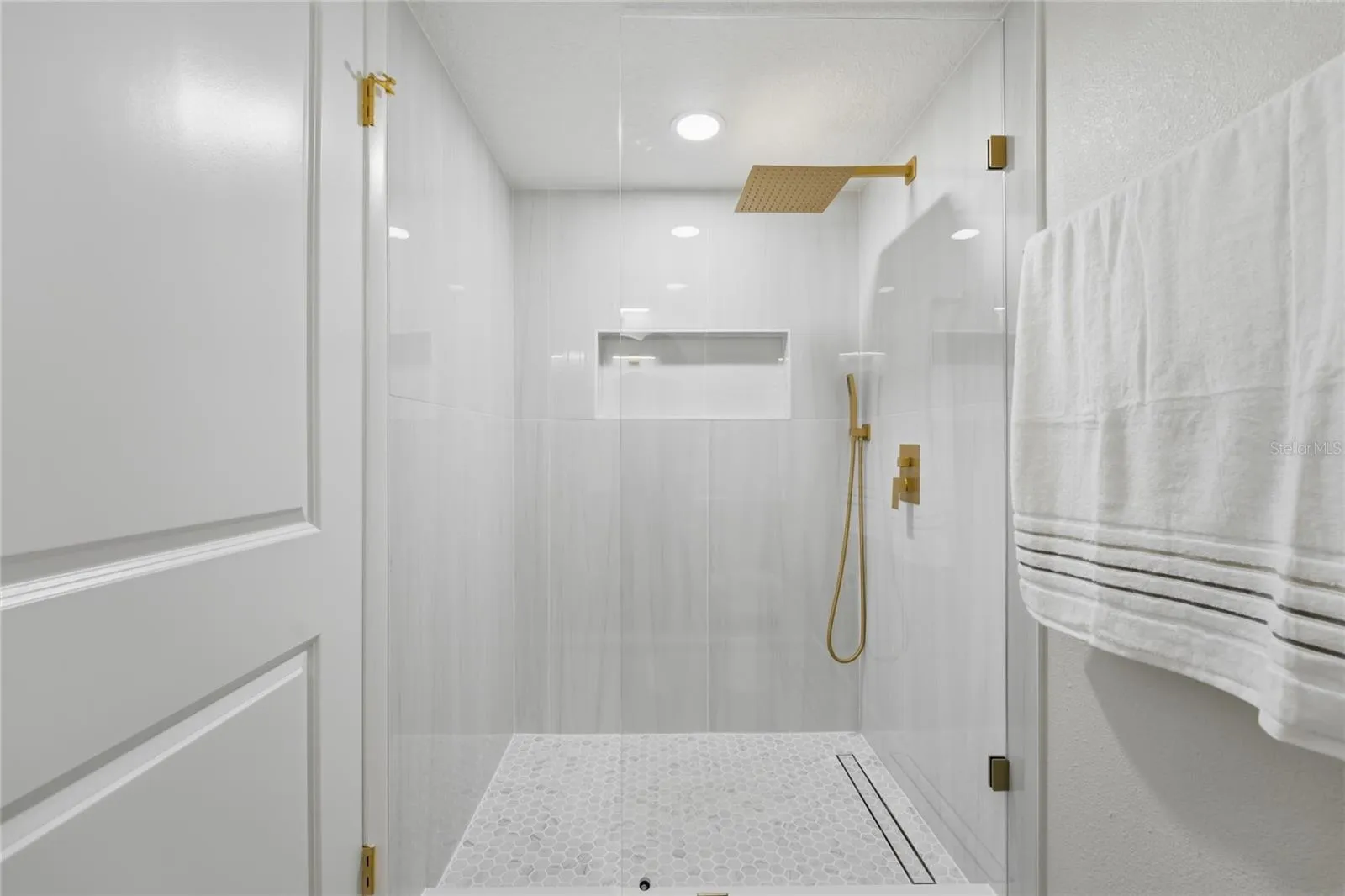 1st Floor bathroom feautring a stunning porcelain-tiled walk-in shower