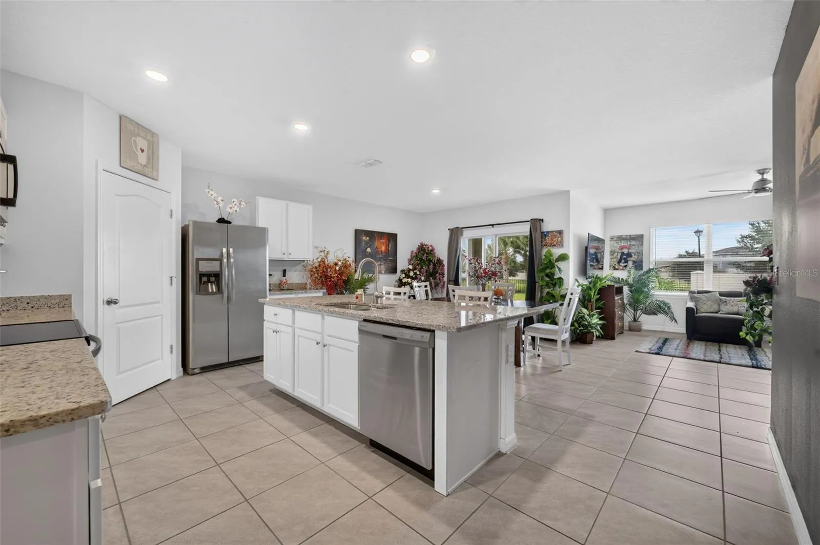 Open floor plan featuring a spacious kitchen, dining area, and living room.