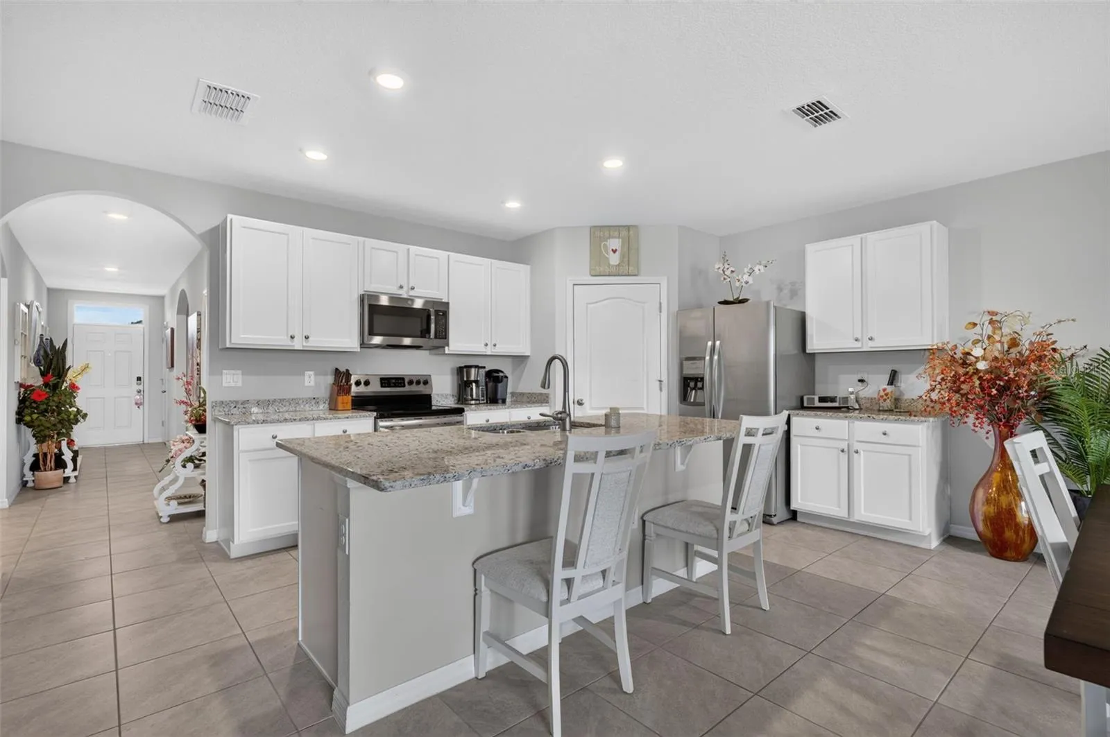 Spacious kitchen featuring a large center island.