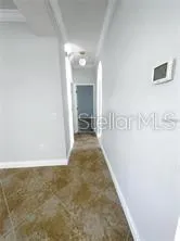 Hall to Primary Bedroom and Laundry/Garage