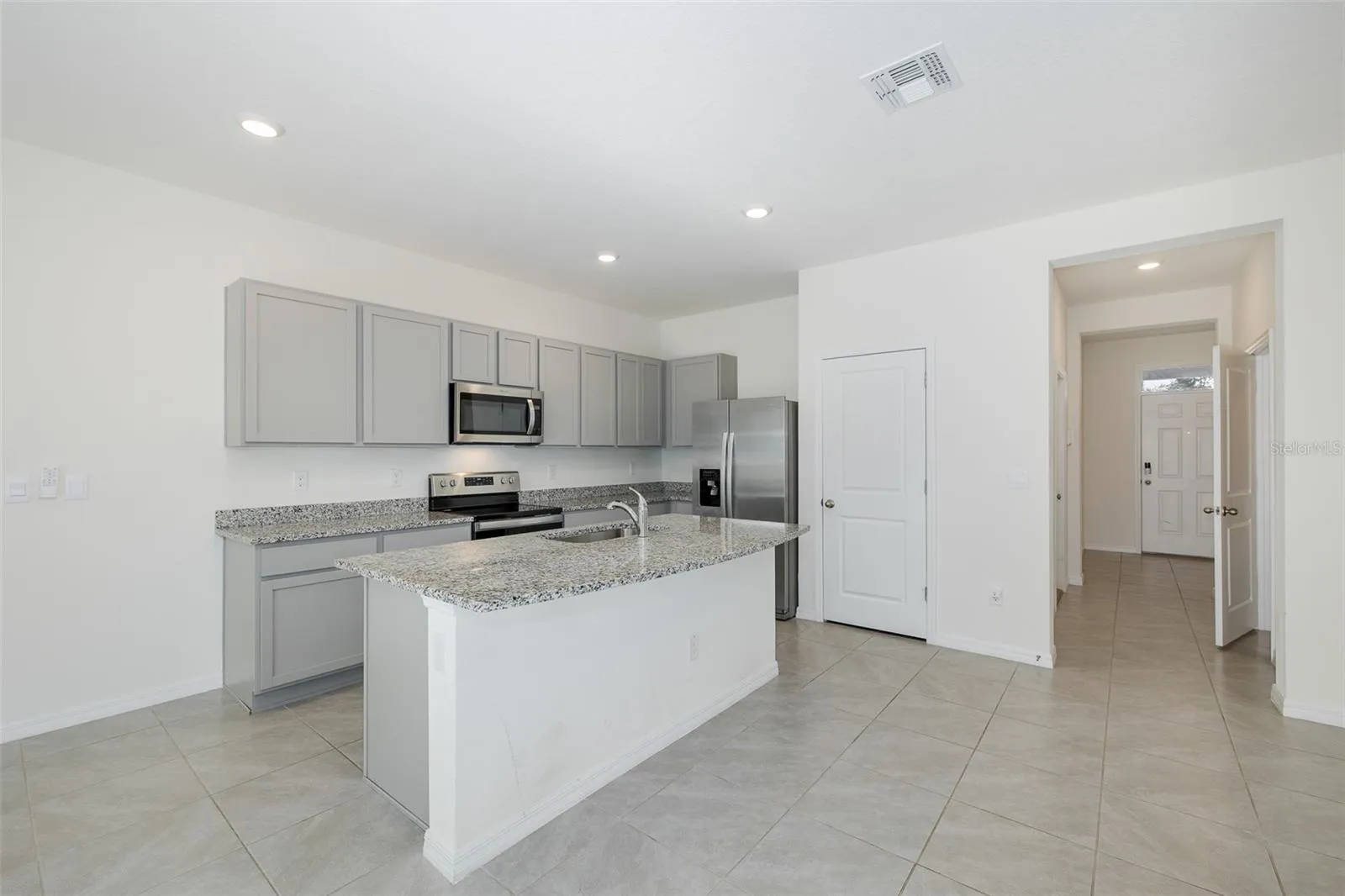 Large Kitchen with Walk In Pantry and Stainless Steel Appliances