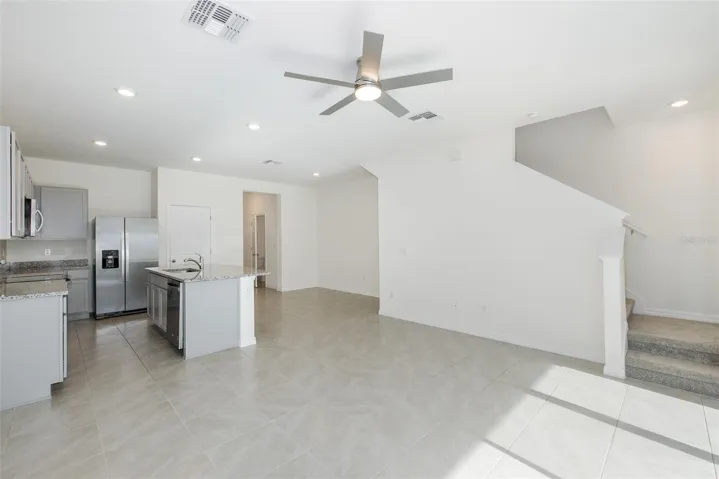 The open-concept design flows seamlessly into the living and dining areas—perfect for today's lifestyle.
