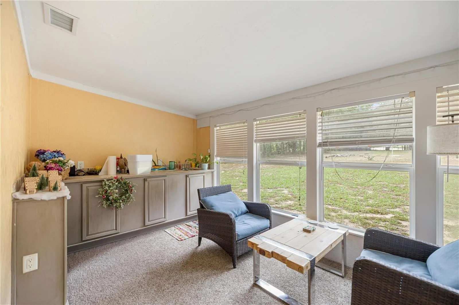 SUN ROOM WITH SUMMER KITCHEN CABINETS