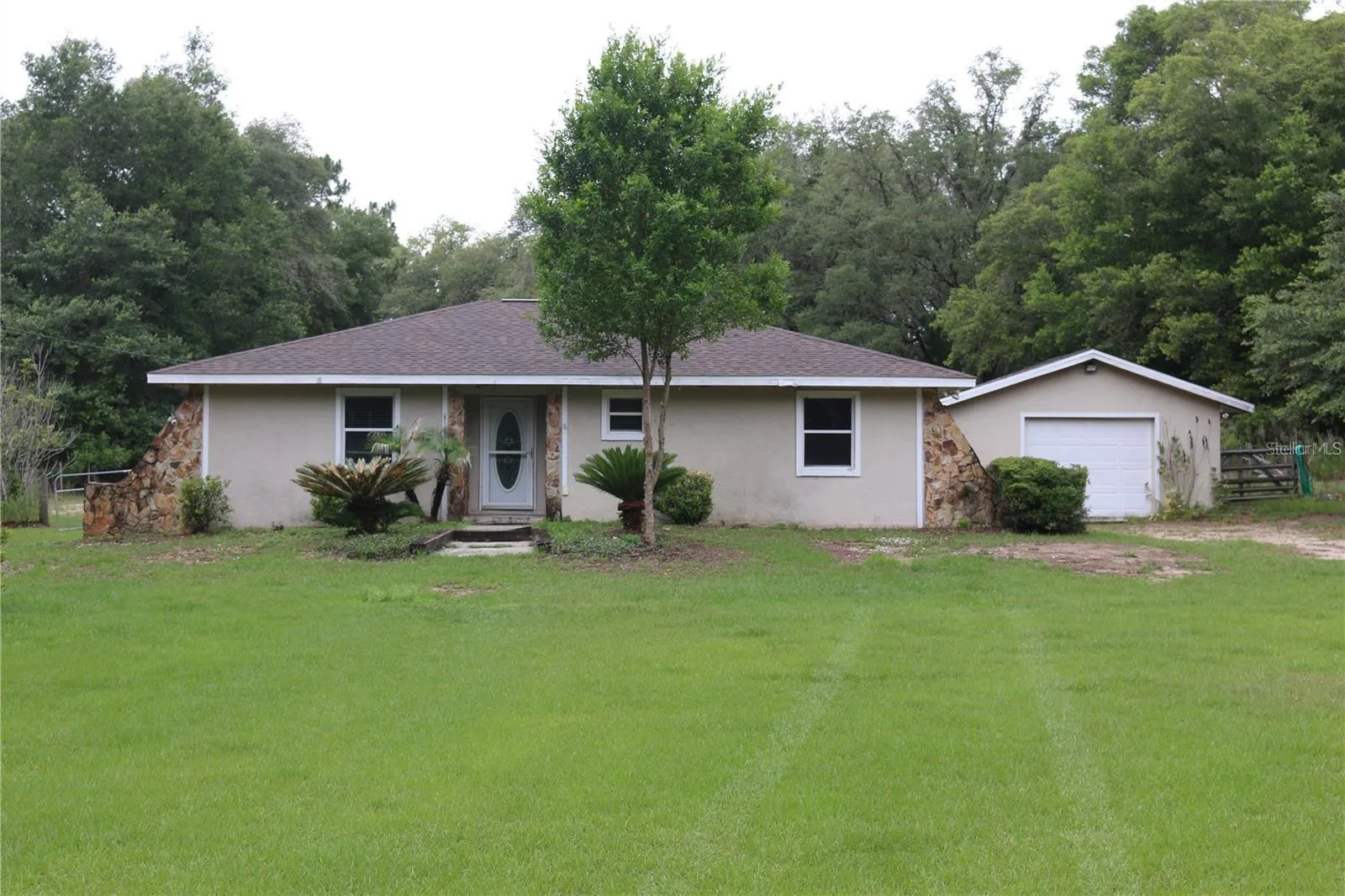 FROM  ENTRANCE 202ND CT LOOKING TO FRONT DOOR &amp; ATTACHED GARAGE
