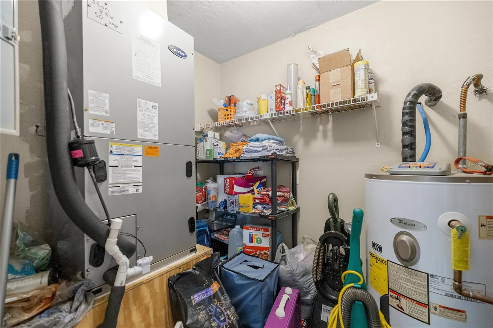 LIVING AREA STORAGE WATER HTR &amp; AC CLOSET