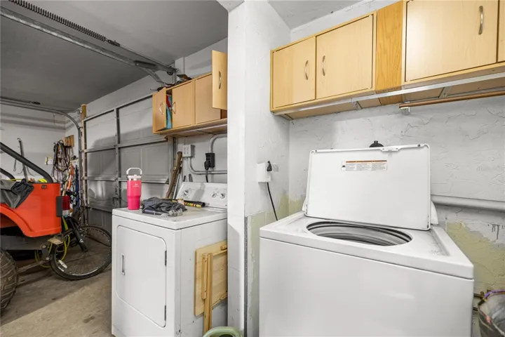 INSIDE LAUNDRY ROOM AND ATTACHED 1 CAR GARAGE/WORKSHOP