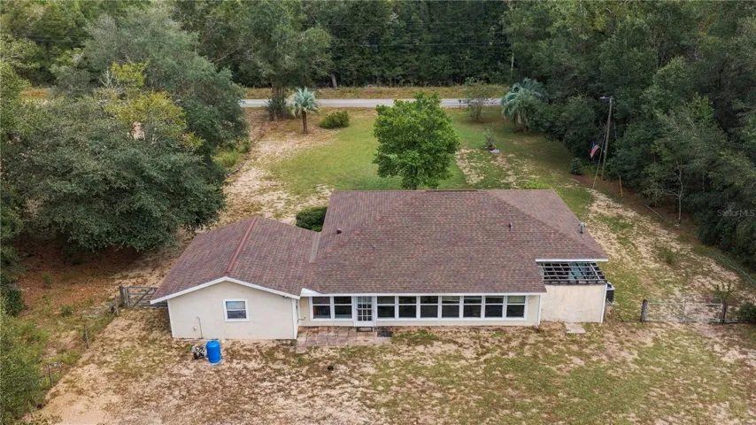 REAR OF HOME FROM ABOVE IN THE WESTERLY SKY