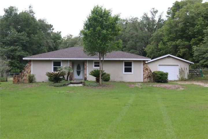 FROM  ENTRANCE 202ND CT LOOKING TO FRONT DOOR &amp; ATTACHED GARAGE