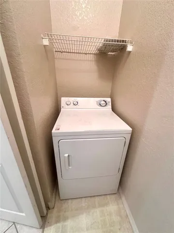 Dryer off Kitchen in Laundry Closet