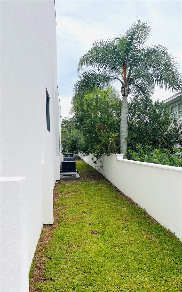 SOUTH SIDE WITH SURROUNDING WALL