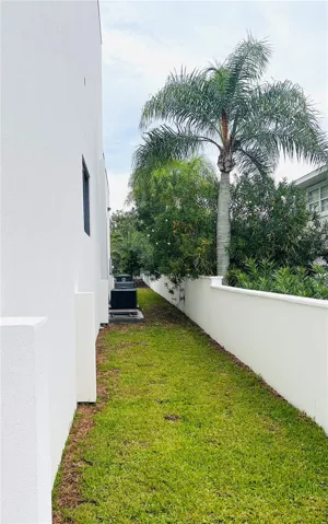 SOUTH SIDE WITH SURROUNDING WALL