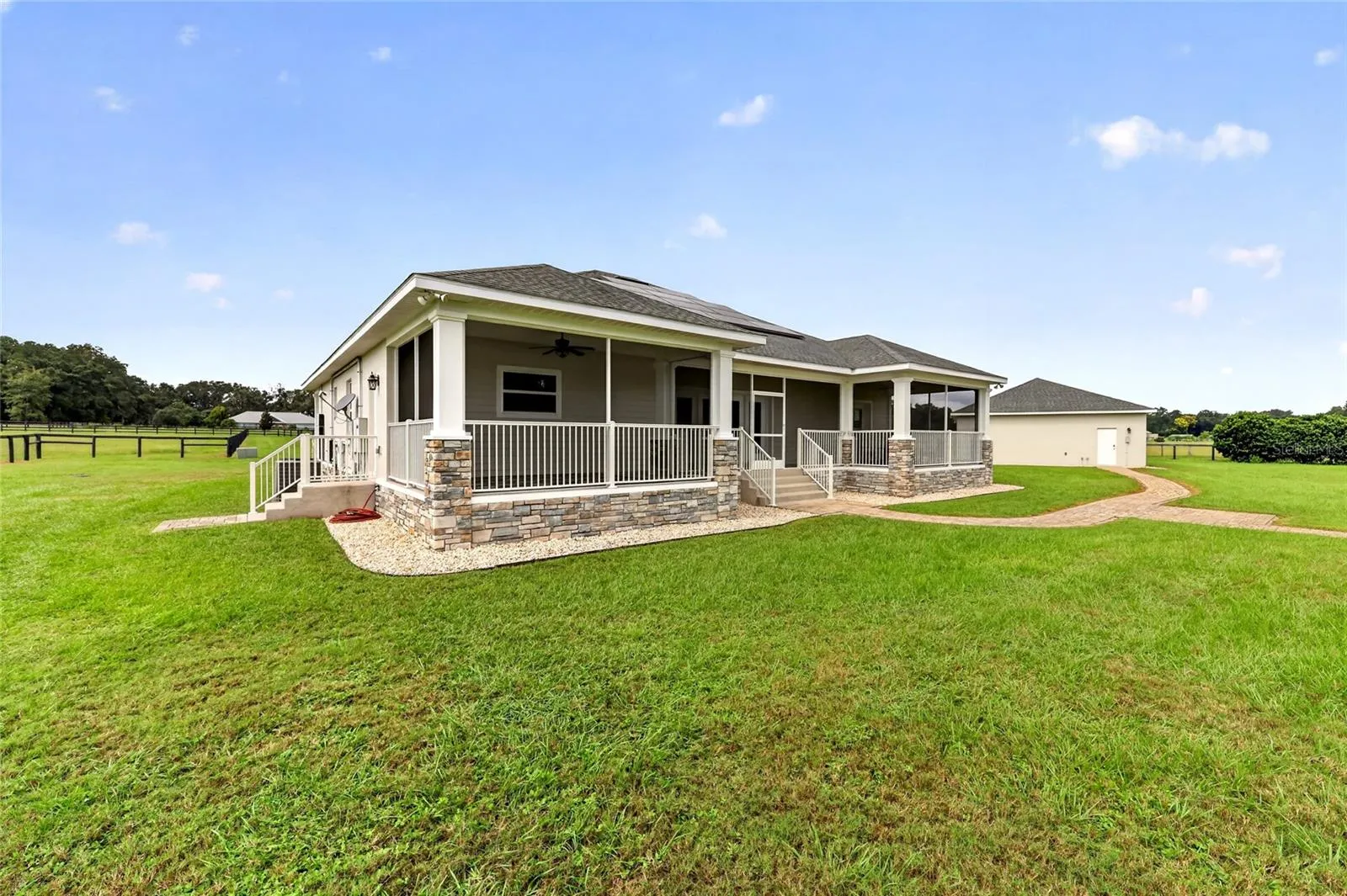 Expansive rear screened porch.