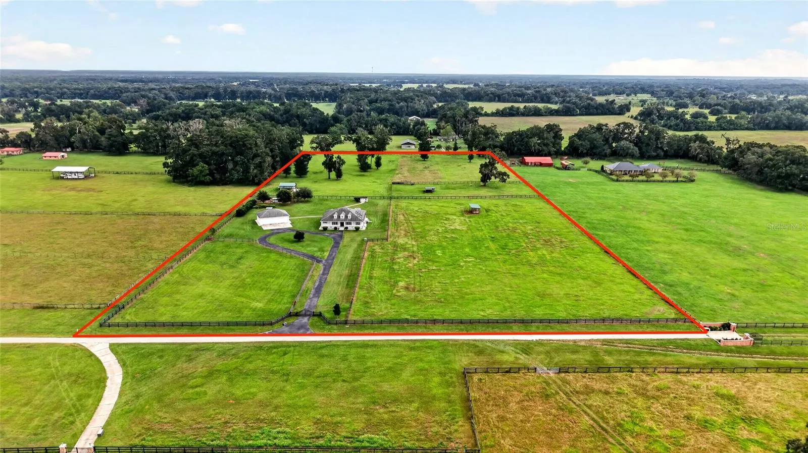 13.58 acres with mature pasture.