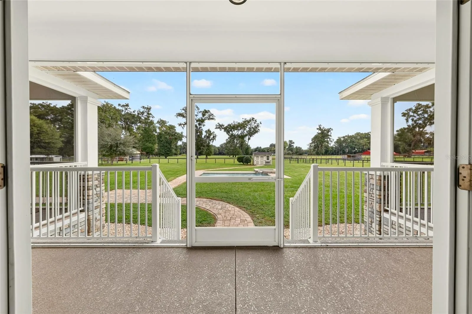 Expansive rear screened porch.