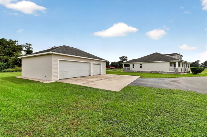 Oversized 3 car garage with 8' tall roll up doors.