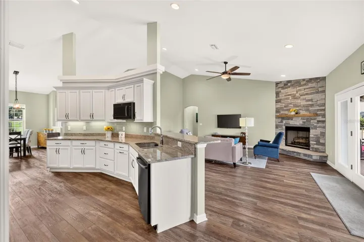 Large kitchen with pantry is open to living area.