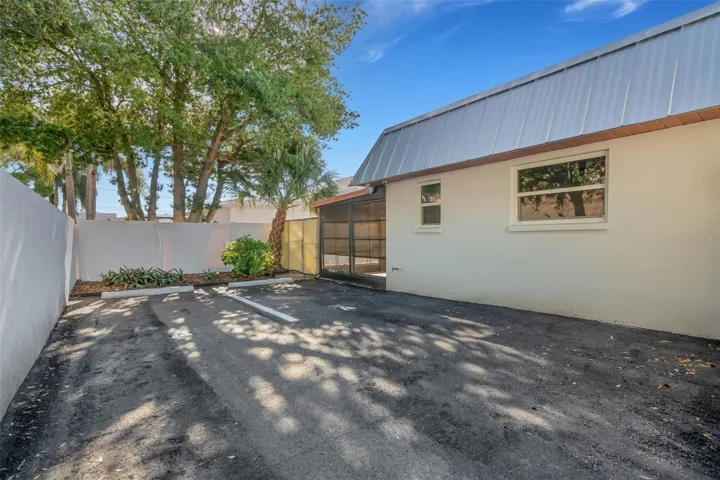 side angle with 2 parking lots or backyard for #A