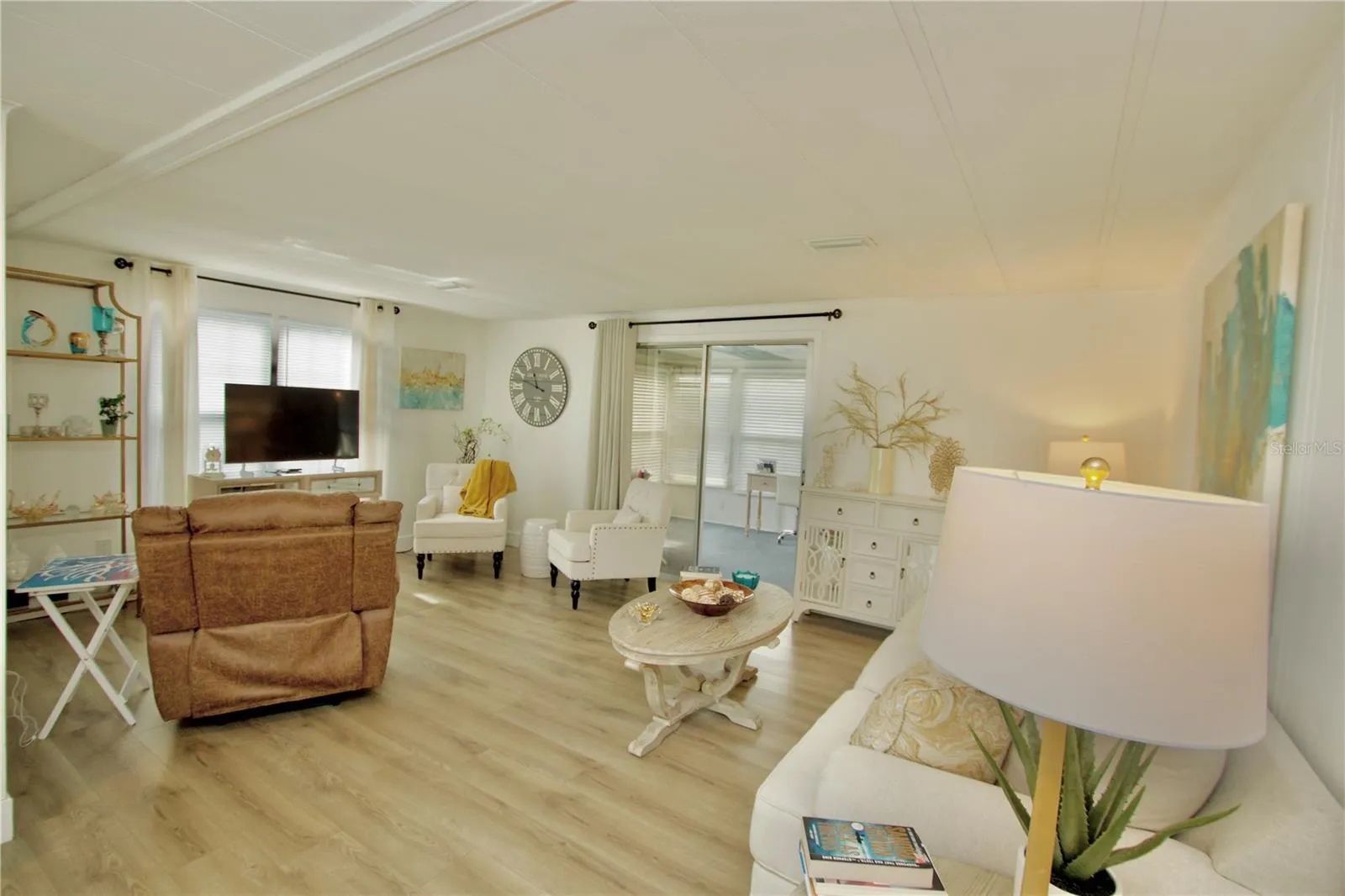 Living Room With Sliders Leading to Sunroom