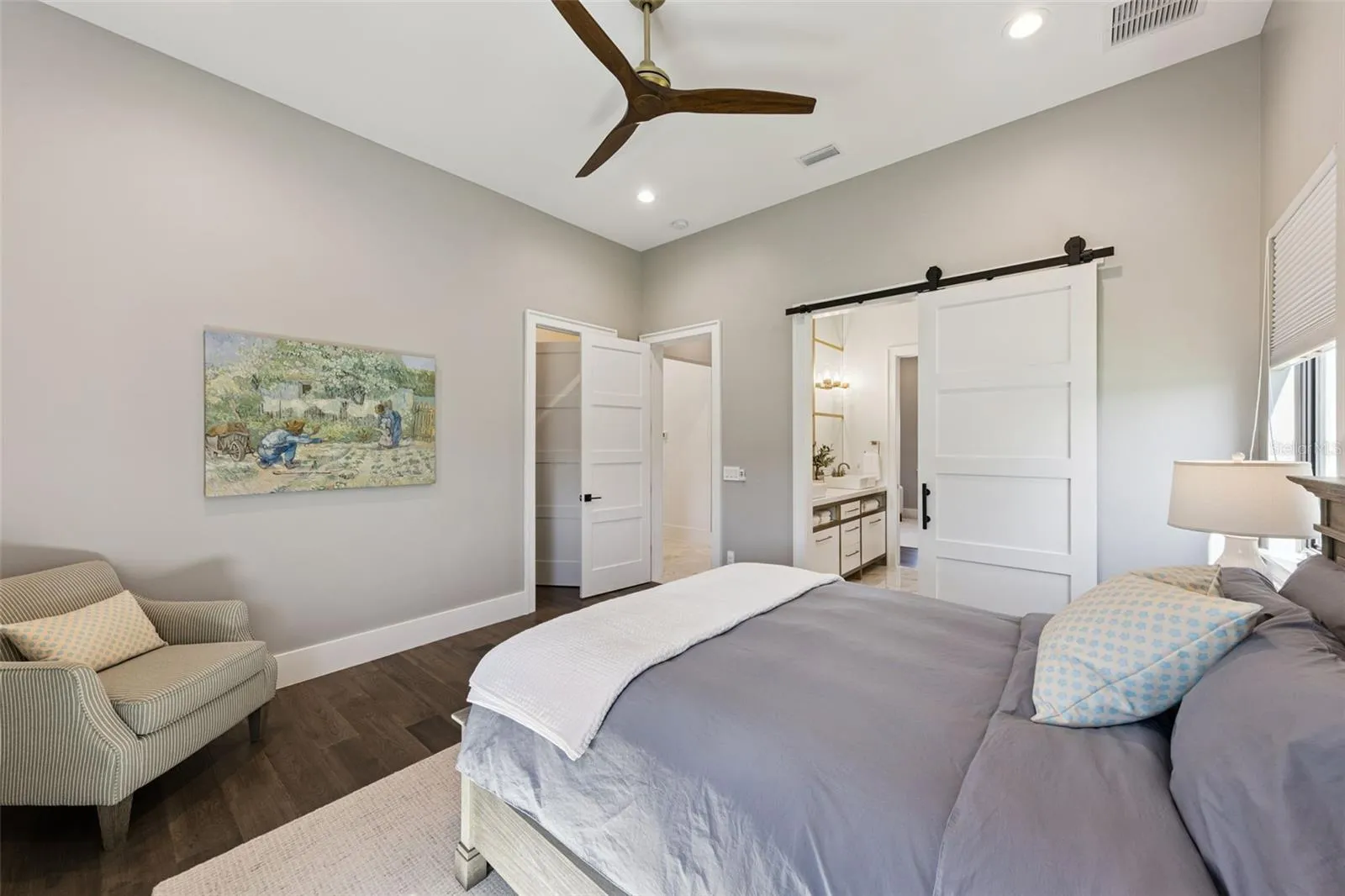Primary bedroom with balcony access