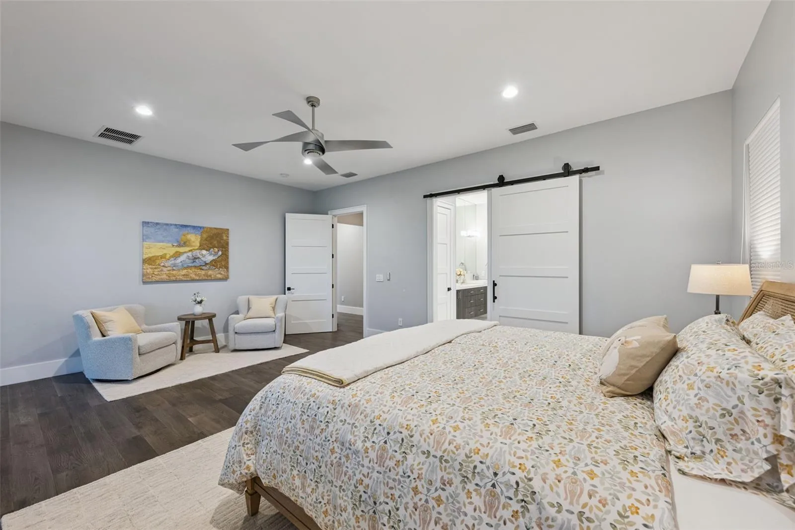 Primary bedroom with balcony access