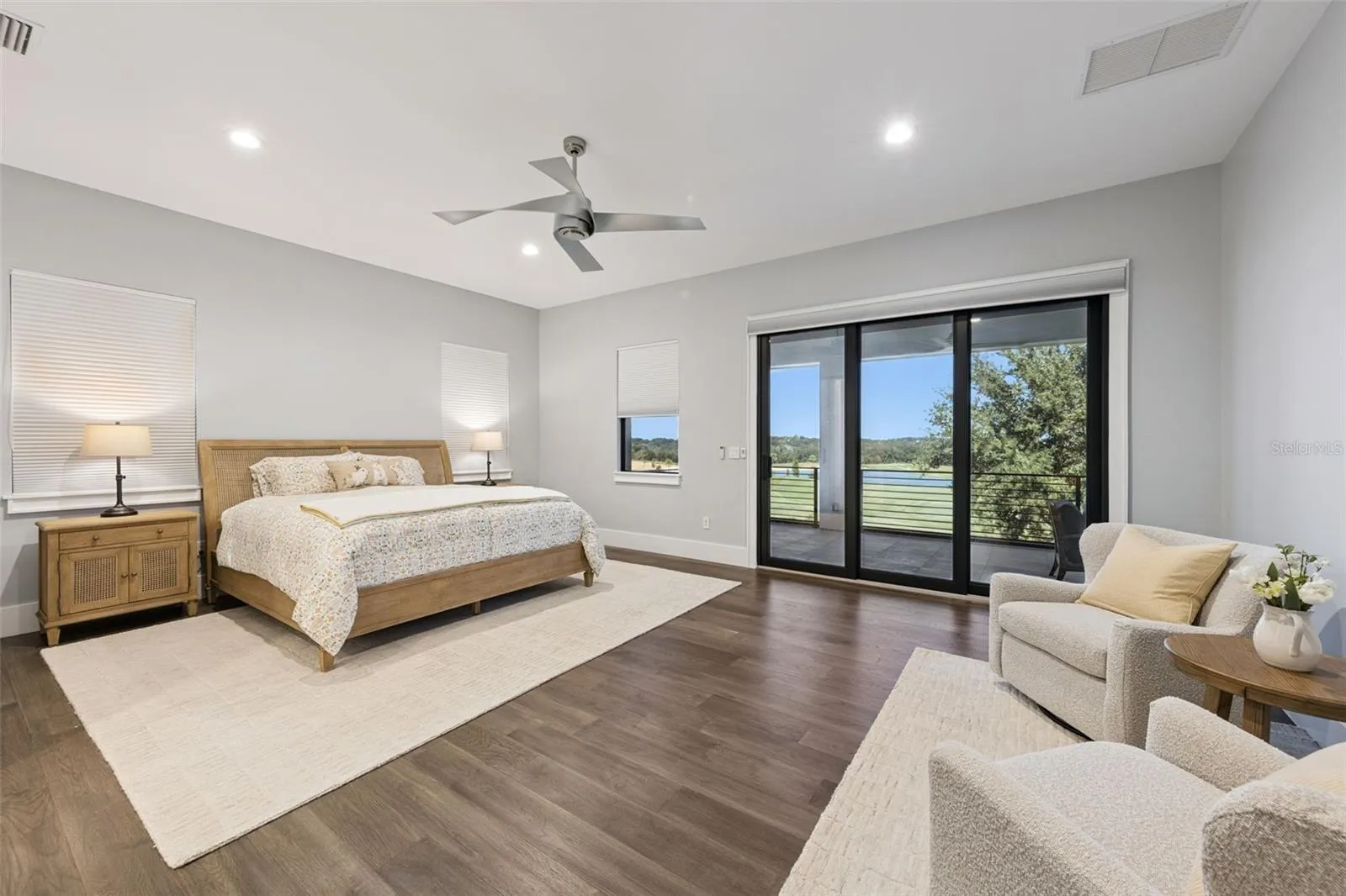 Primary bedroom with balcony access