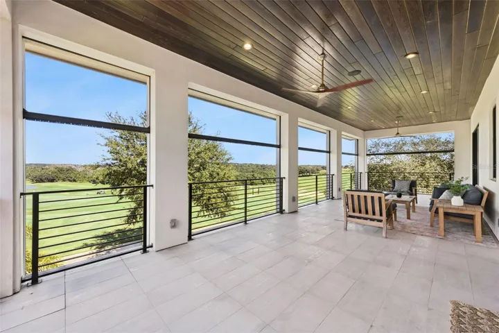 Balcony from primary bedroom, with retractable screens.