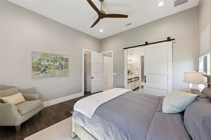 Primary bedroom with balcony access