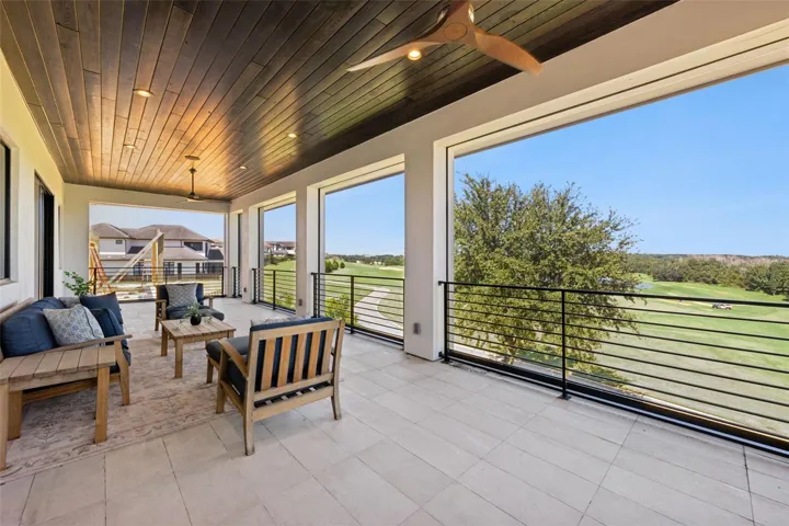 Balcony from primary bedroom, with retractable screens.