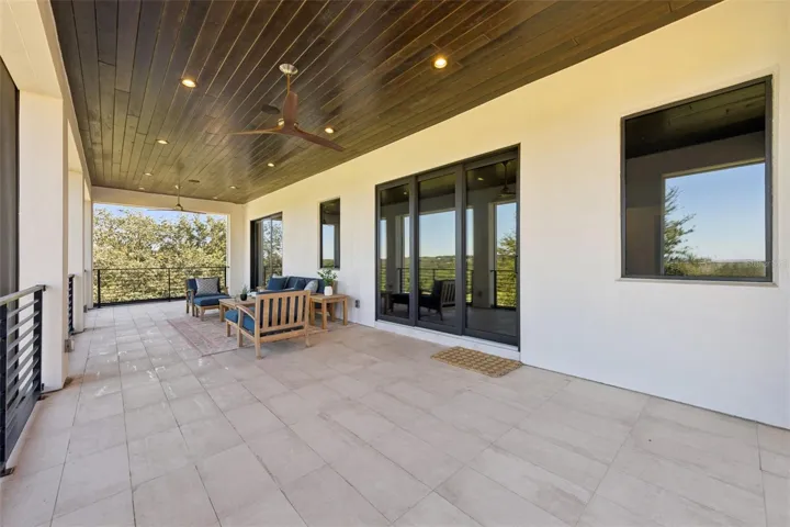 Balcony from primary bedroom, with retractable screens.