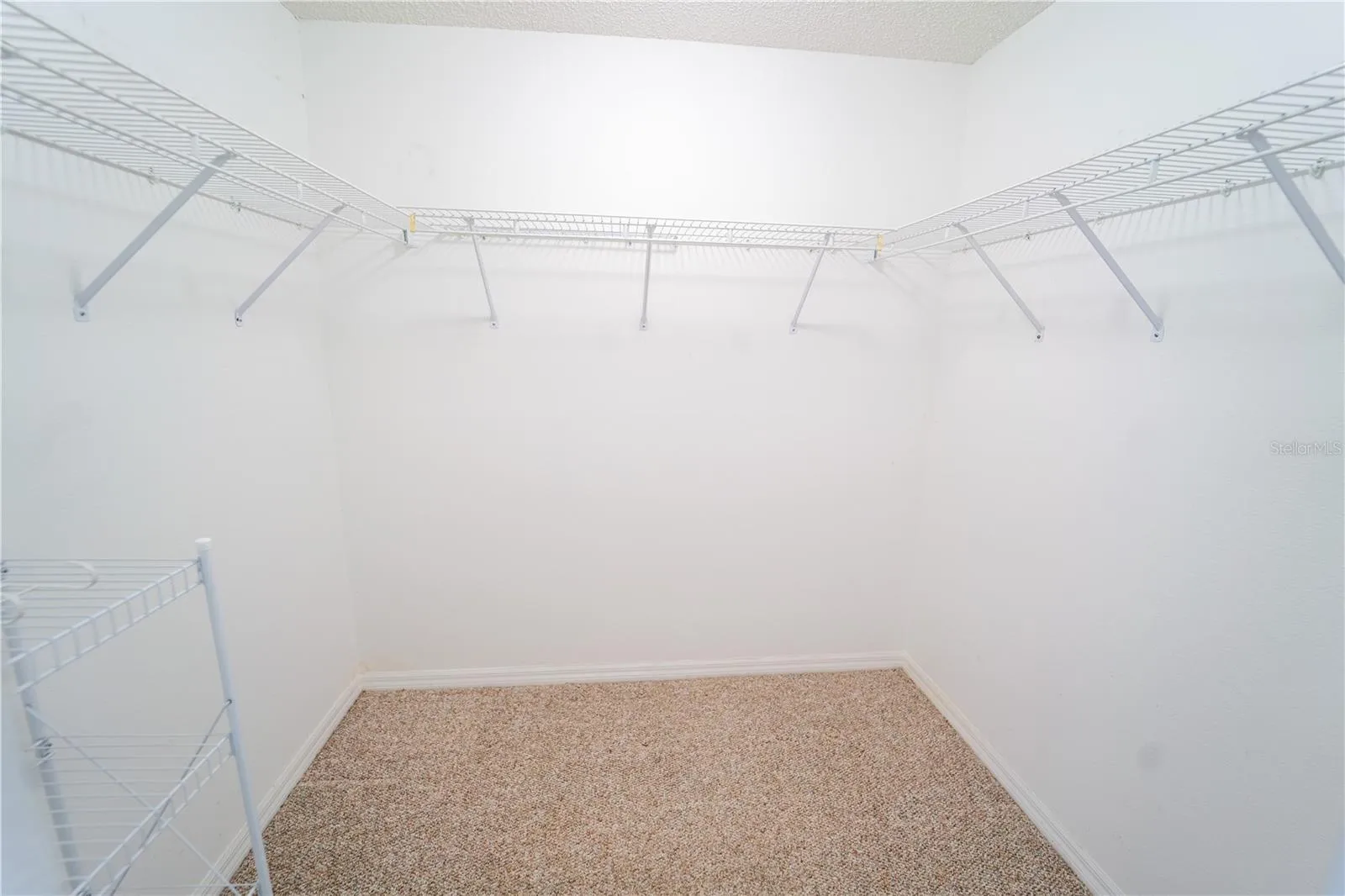 1 of 2 WALK IN CLOSETS IN PRIMARY
