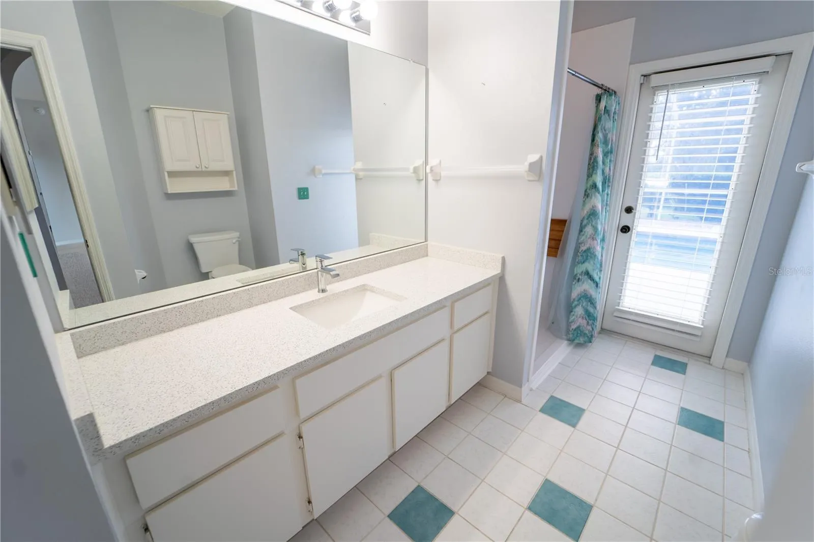 BATHROOM 3 ~ DOOR TO POOL AREA