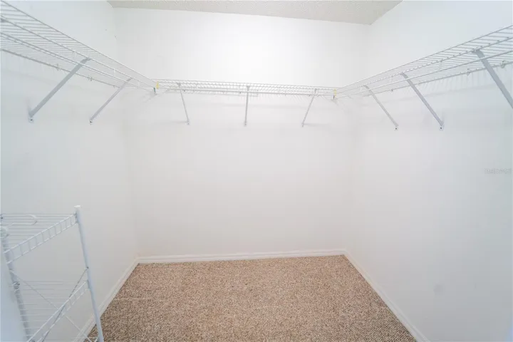 1 of 2 WALK IN CLOSETS IN PRIMARY
