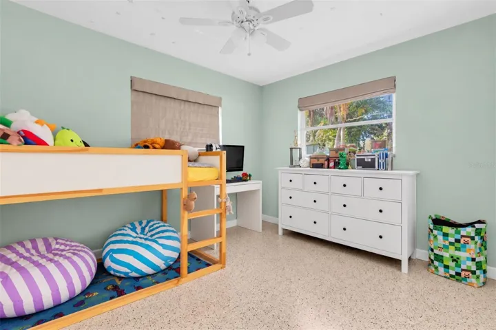 Comfortable secondary bedroom with terrazzo floors