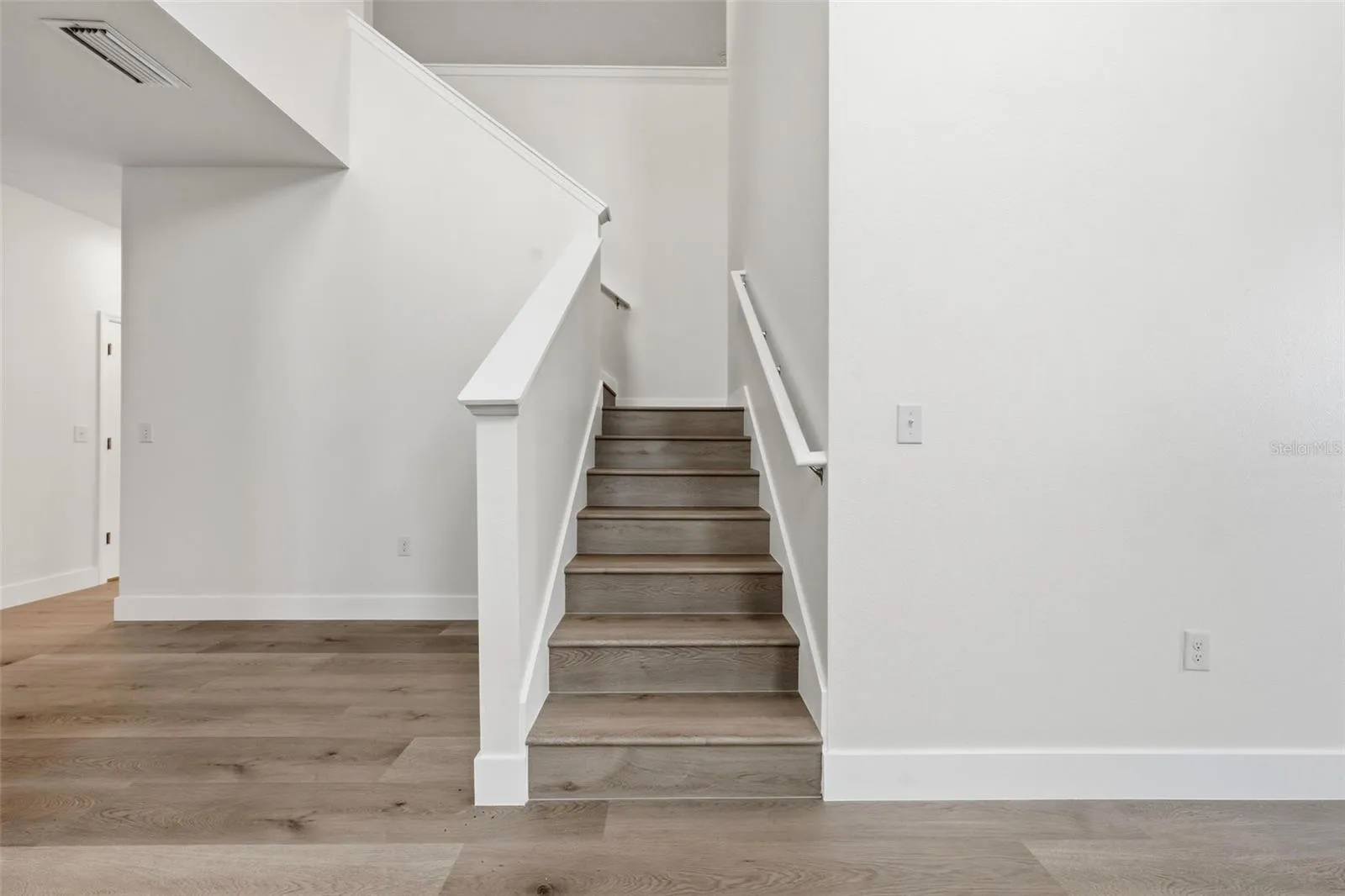 Staircase with new LVP and fresh paint