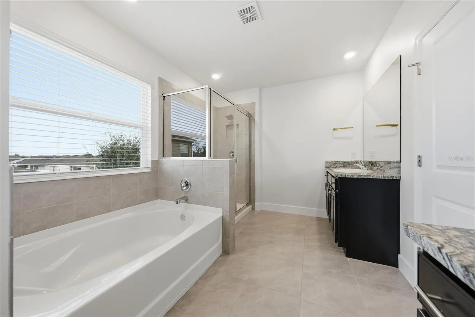 Primary bath with separate vanities