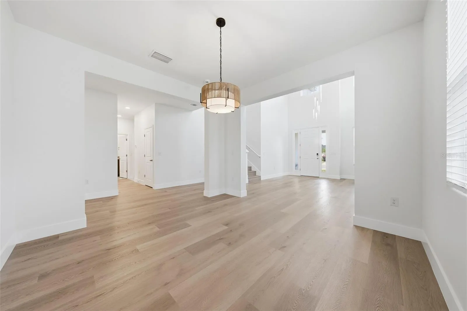 Separate dining room with new light fixture