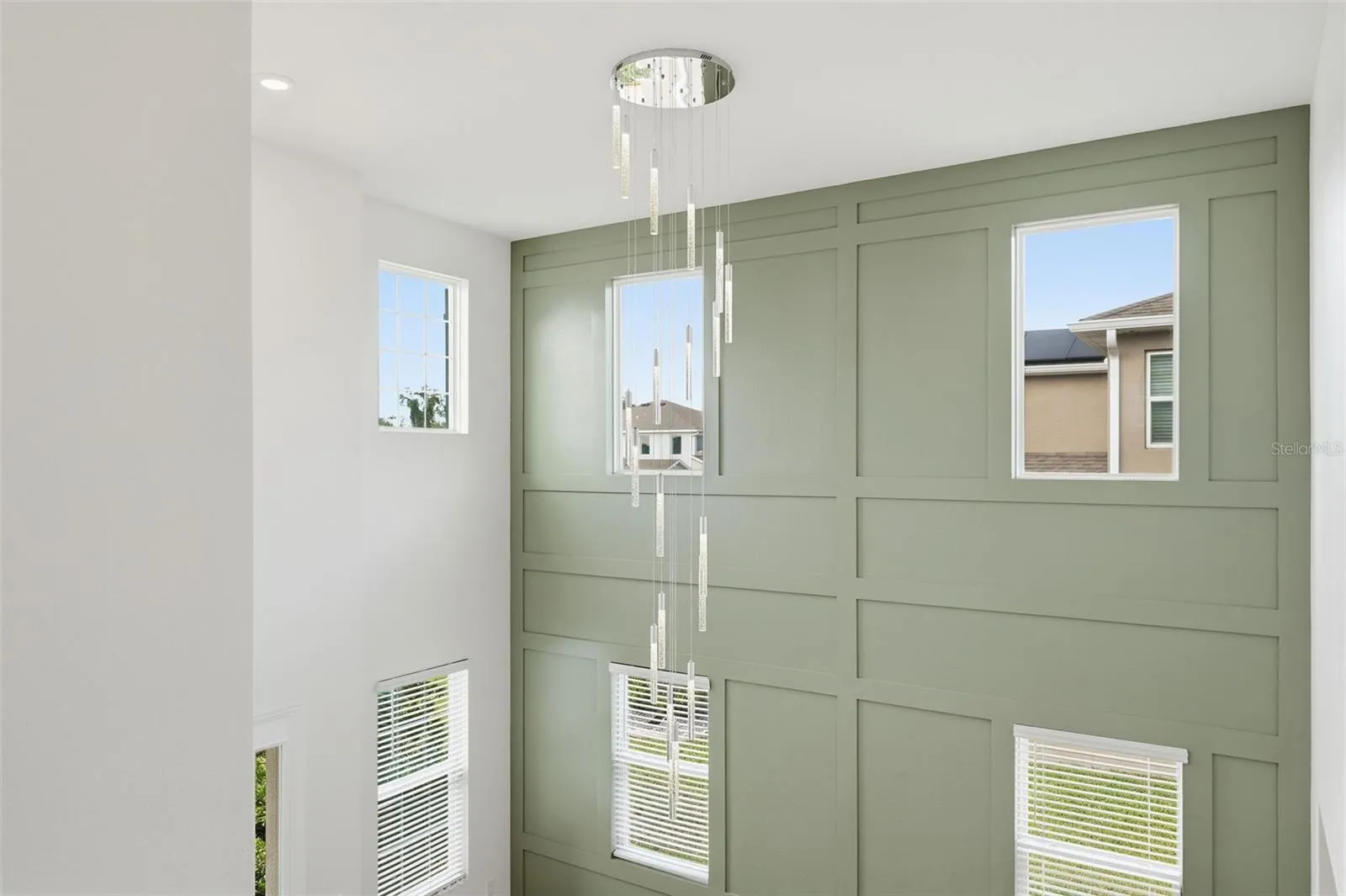 New chandelier anchors the two-story entry