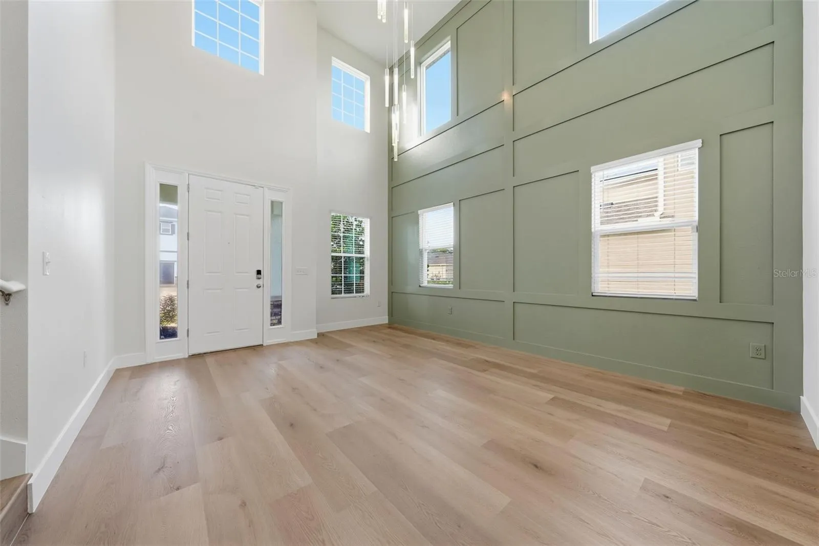 Two-story foyer with new statement chandelier