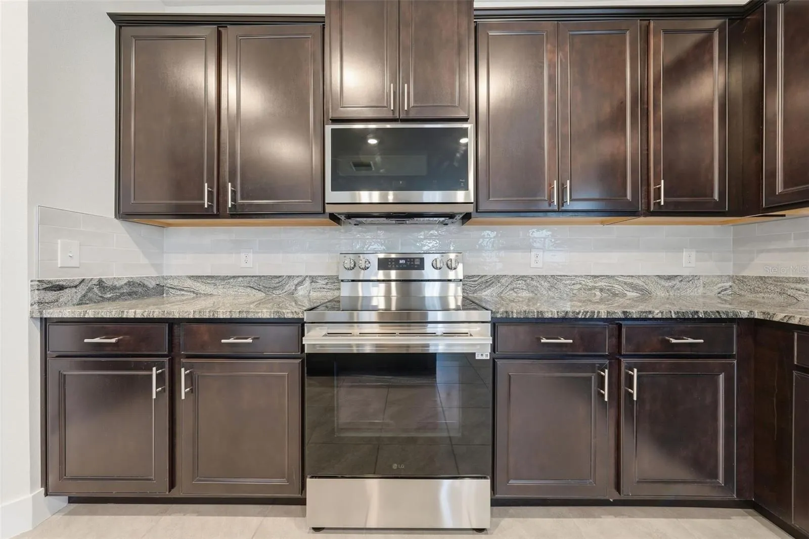 New LG range and microwave with new tile backsplash