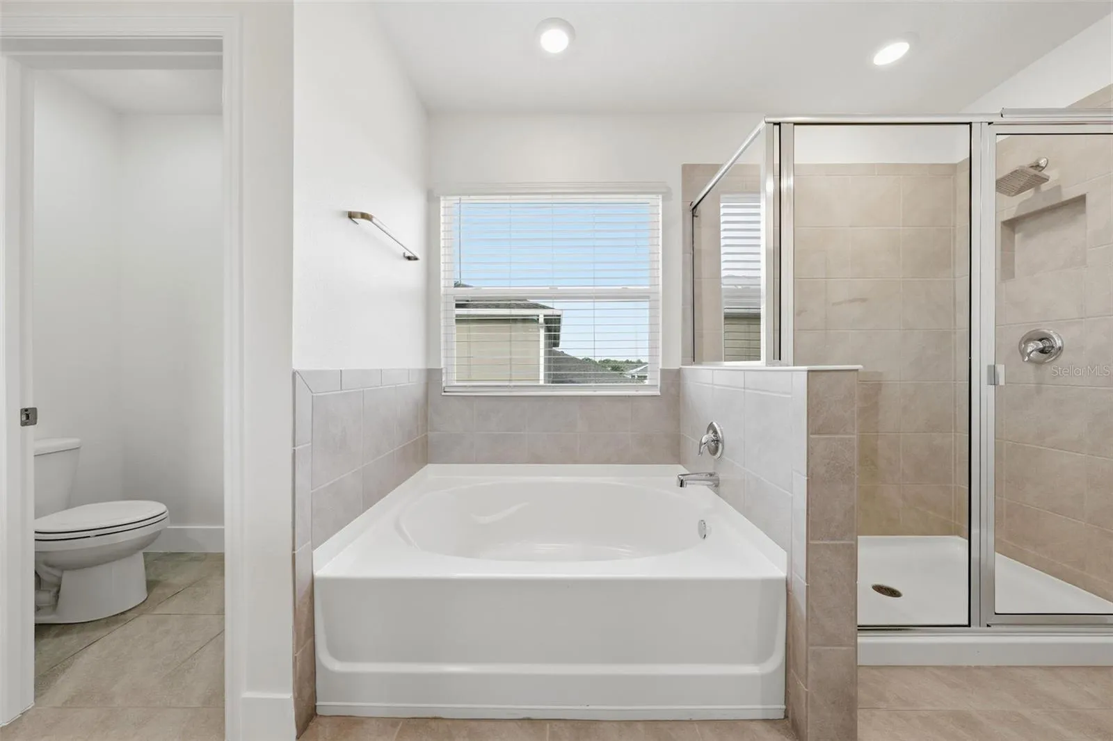Primary bath with soaking tub and walk-in shower