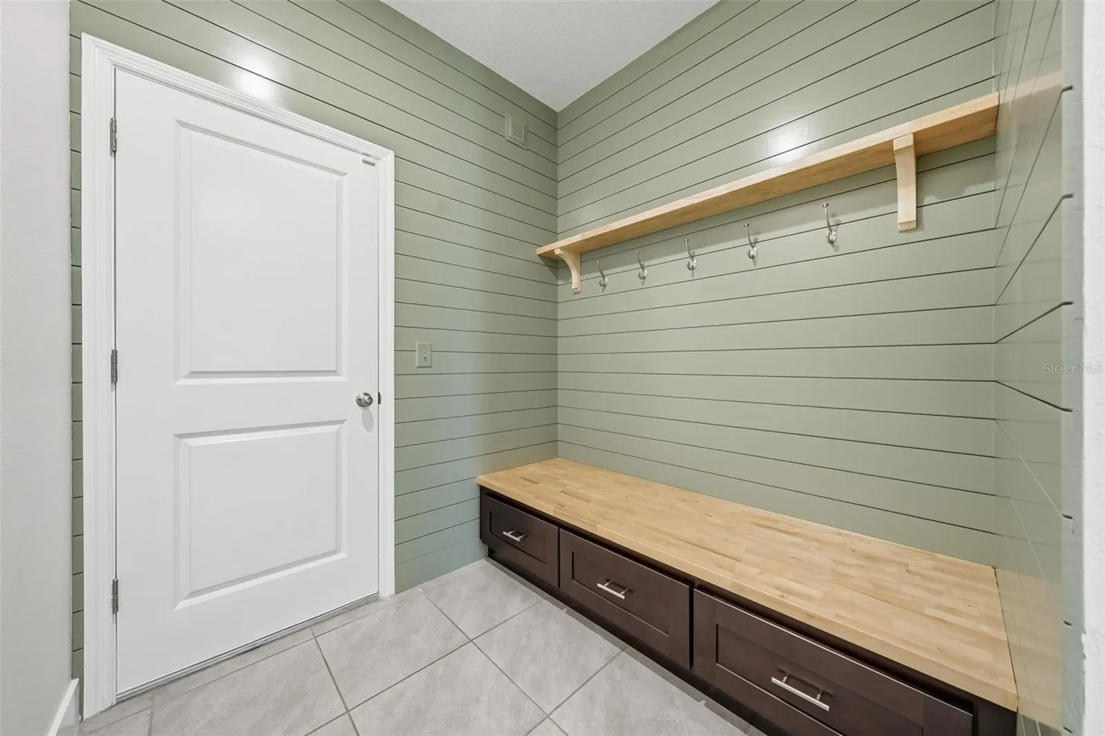 Custom mudroom drop zone off the garage