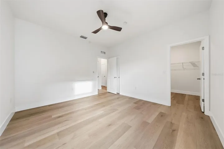 Downstairs bedroom suite with walk-in closet