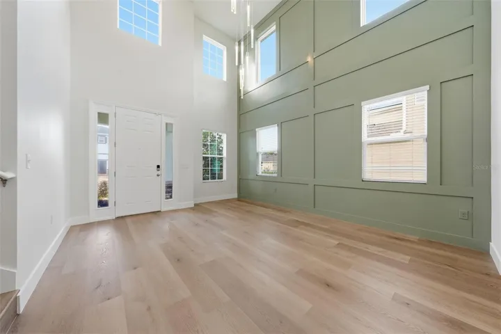 Two-story foyer with new statement chandelier