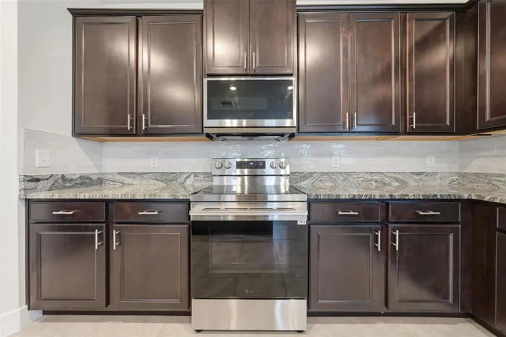 New LG range and microwave with new tile backsplash