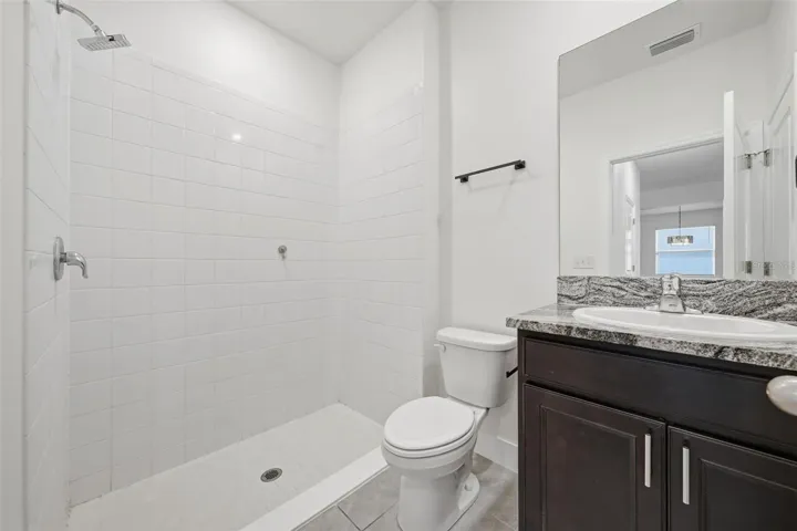 Downstairs en-suite bath with walk-in shower